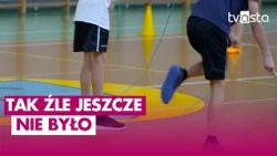 A jump rope hurdle. Children struggle with physical exercises